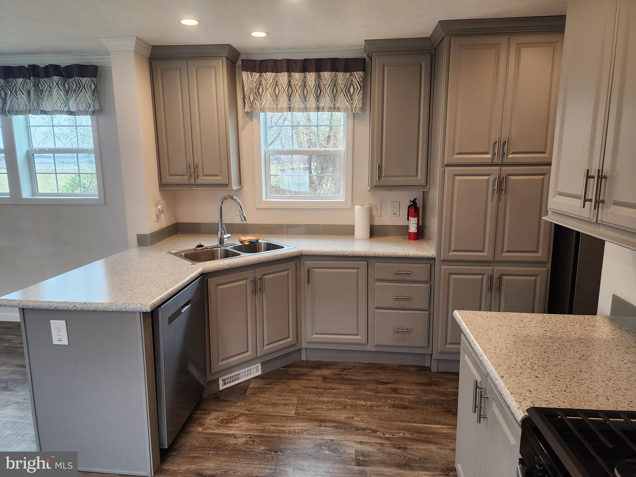 165 West Ridge Pike, Unit 260 Royersford, PA 19468 - Photo 14 of 15 a kitchen with kitchen island granite countertop a sink stove and refrigerator