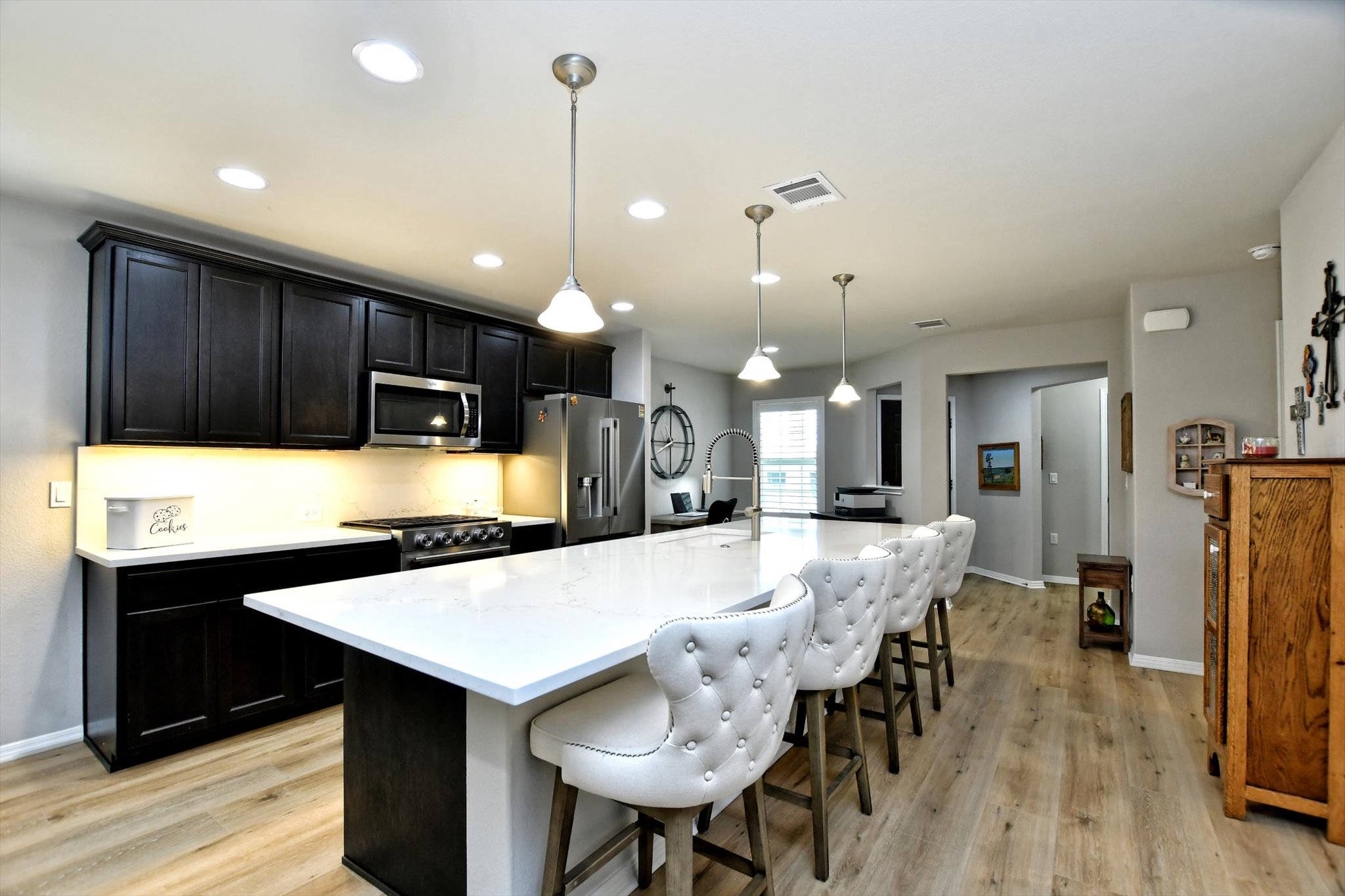 231 Hobby Street Georgetown, TX 78633 - Photo 10 of 29 Culinary delights await in this modern kitchen, featuring pristine countertops and ample prep space.