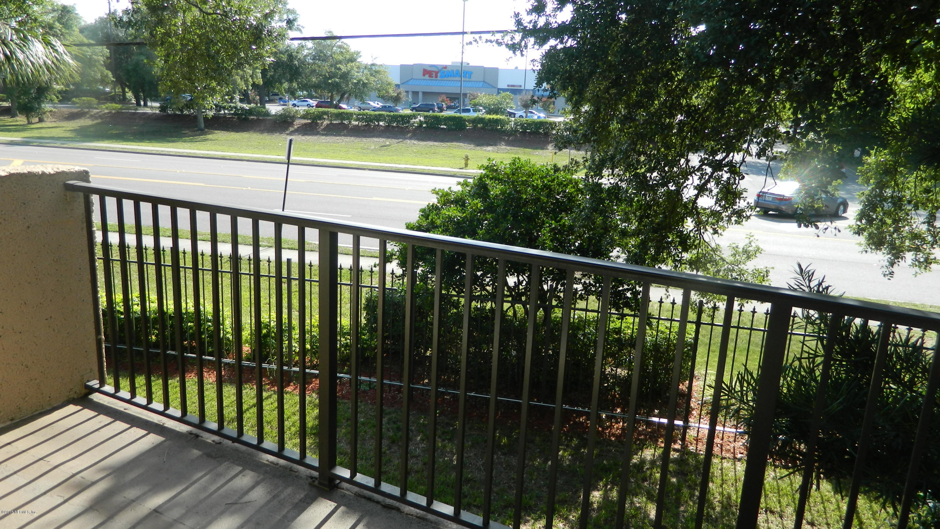 355 Monument Road, Unit 22D2 Jacksonville, FL 32225 - Photo 12 of 14 a view of a balcony with wooden floor