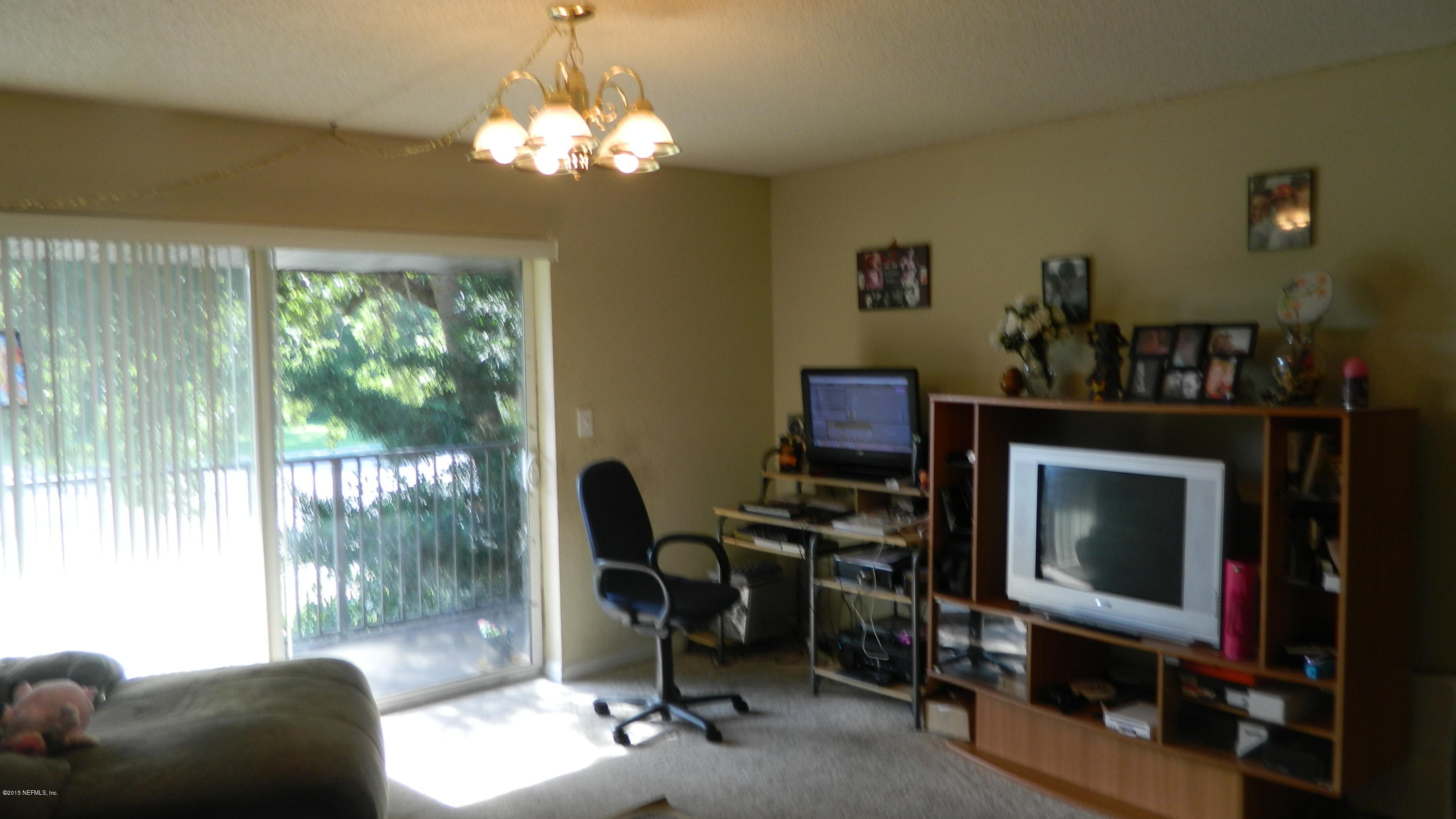 355 Monument Road, Unit 22D2 Jacksonville, FL 32225 - Photo 7 of 14 a view of a livingroom with furniture window and outside view