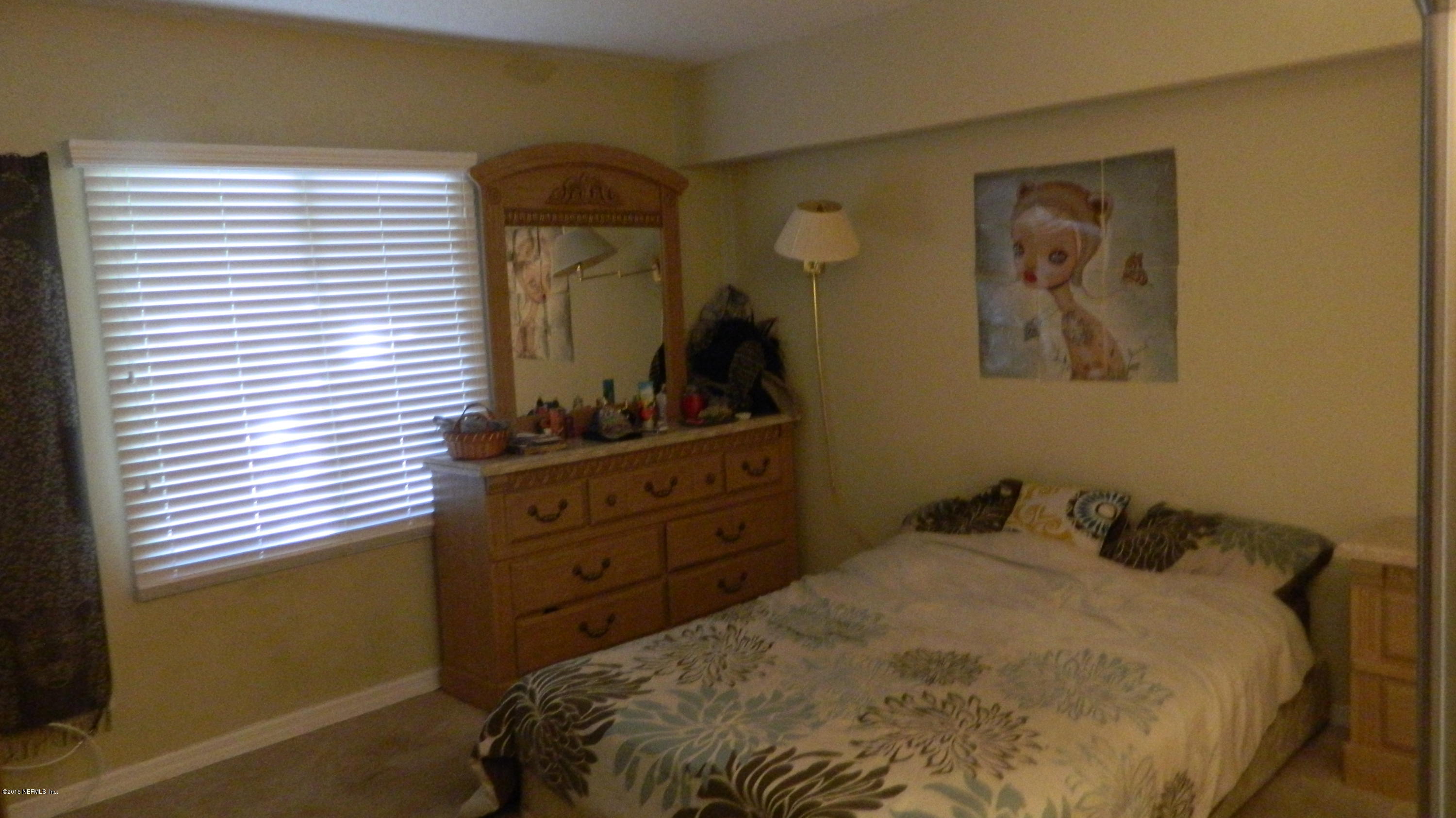 355 Monument Road, Unit 22D2 Jacksonville, FL 32225 - Photo 8 of 14 a bedroom with a bed and a window