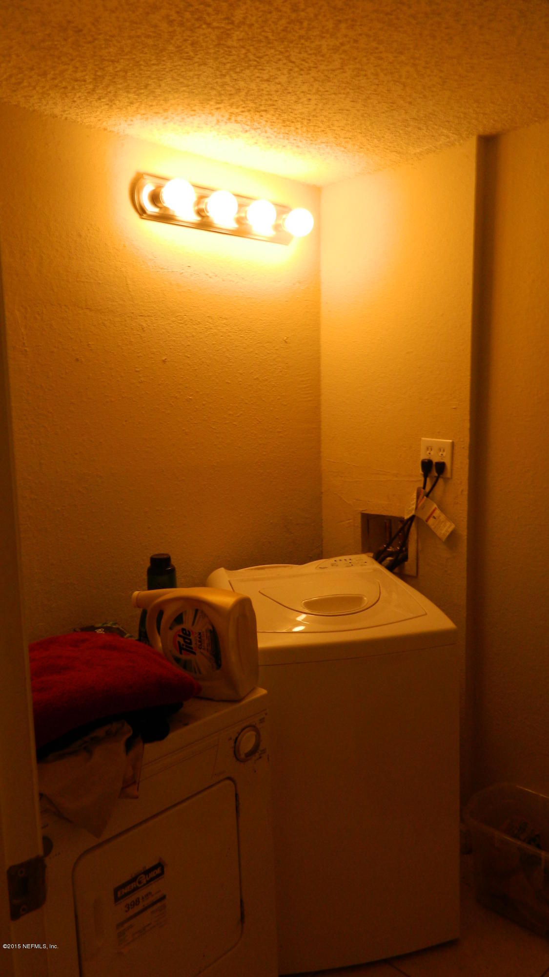 355 Monument Road, Unit 22D2 Jacksonville, FL 32225 - Photo 10 of 14 a bathroom with a sink and cabinets