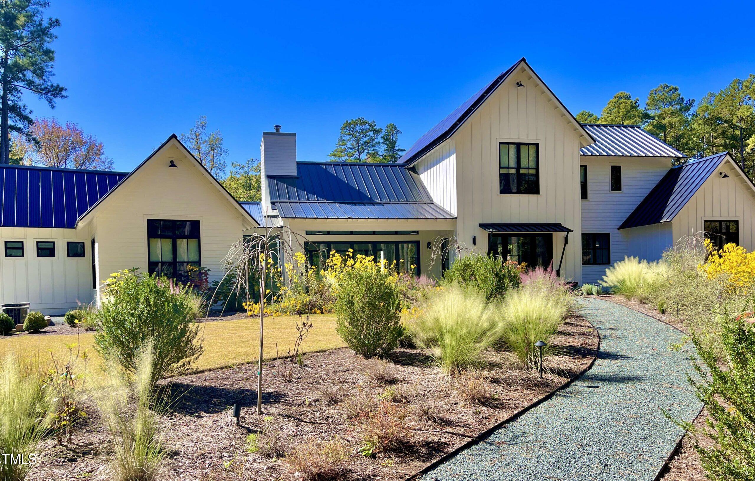 120 Anfield Road New Hill, NC 27562 - Photo 21 of 31 a front view of a house with a yard