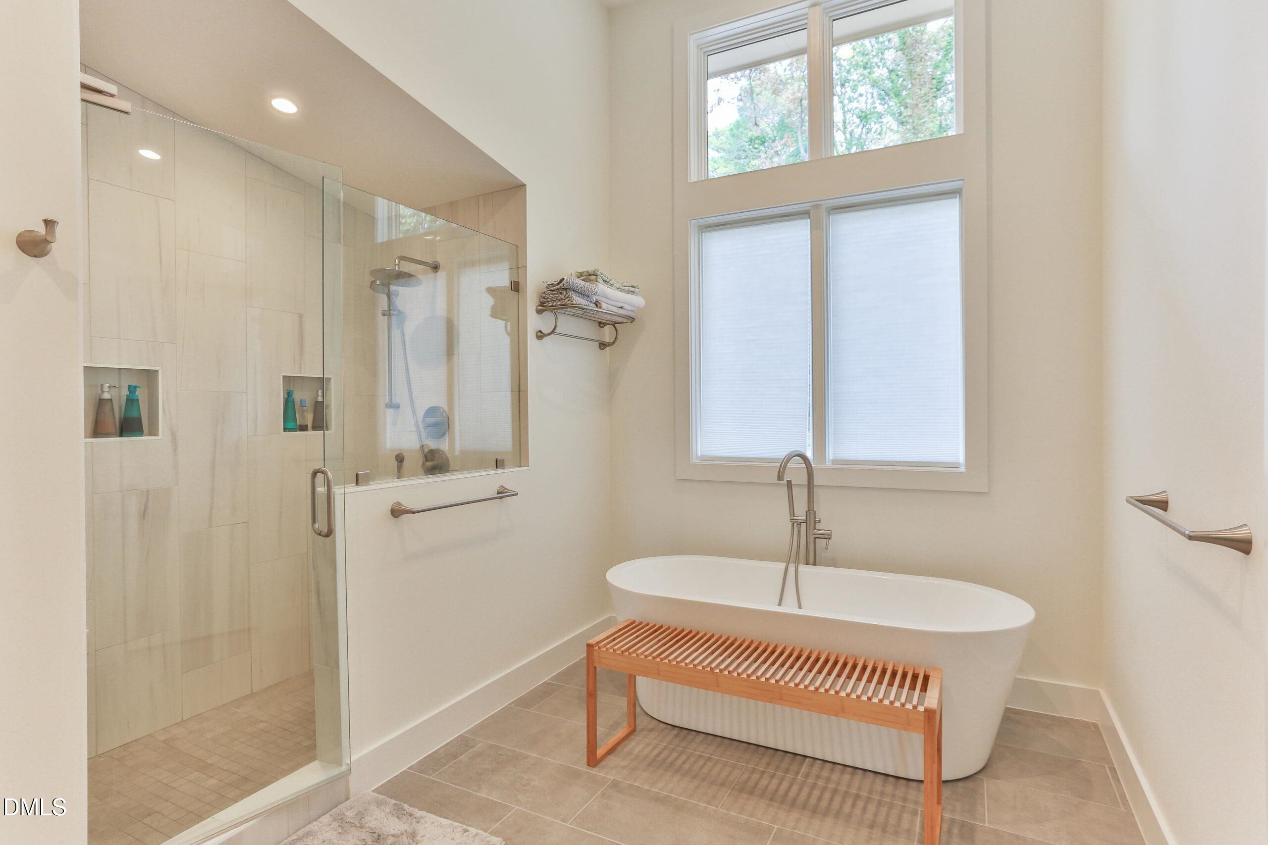 120 Anfield Road New Hill, NC 27562 - Photo 7 of 31 a bathroom with a sink tub and shower
