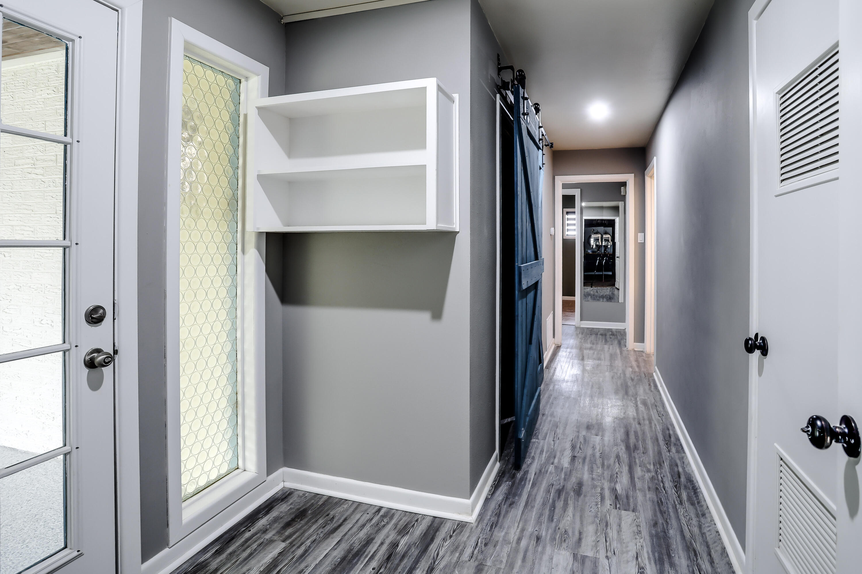 3615 47th Street Lubbock, TX 79413 - Photo 22 of 36 a view of hallway with wooden floor