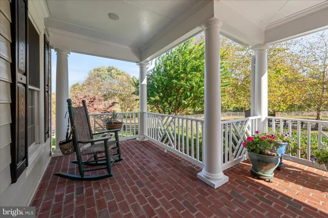 a front view of a house with a yard table and chairs