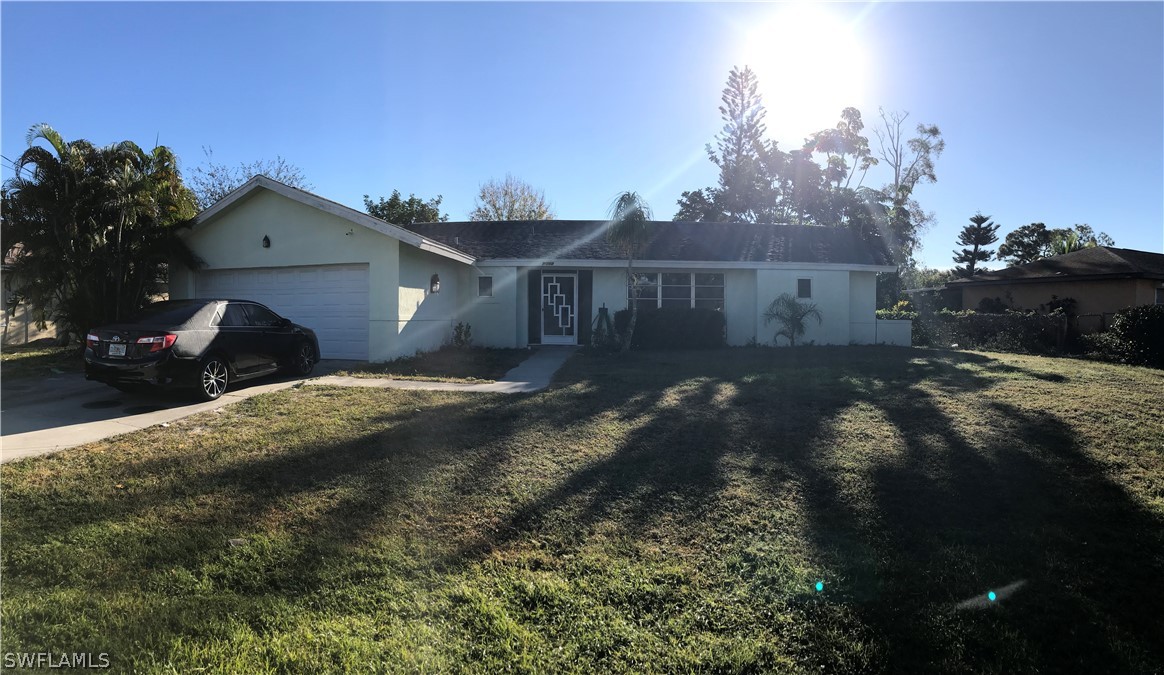 7312 Pebble Beach Road Fort Myers, FL 33967 - Photo 3 of 30 a view of a house with a yard