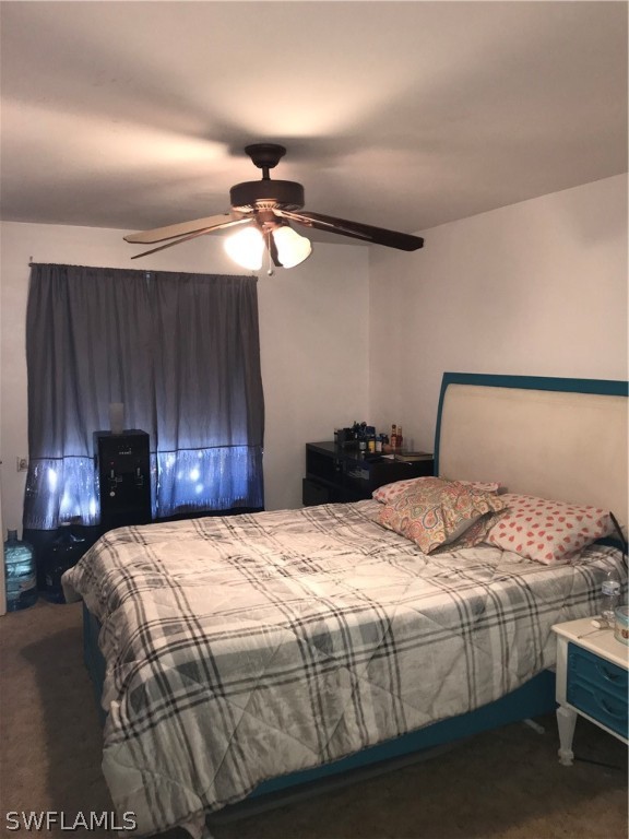 7312 Pebble Beach Road Fort Myers, FL 33967 - Photo 9 of 30 a bedroom with a bed and a lamp