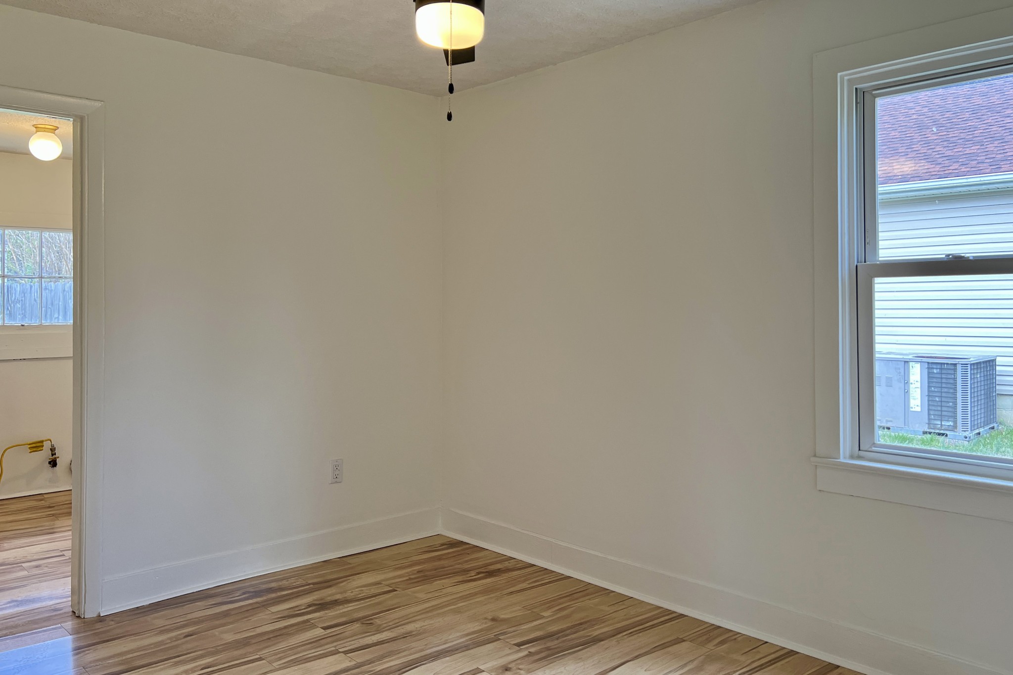 401 North High Street Franklin, KY 42134 - Photo 12 of 28 a view of a room that has a window and wooden floor
