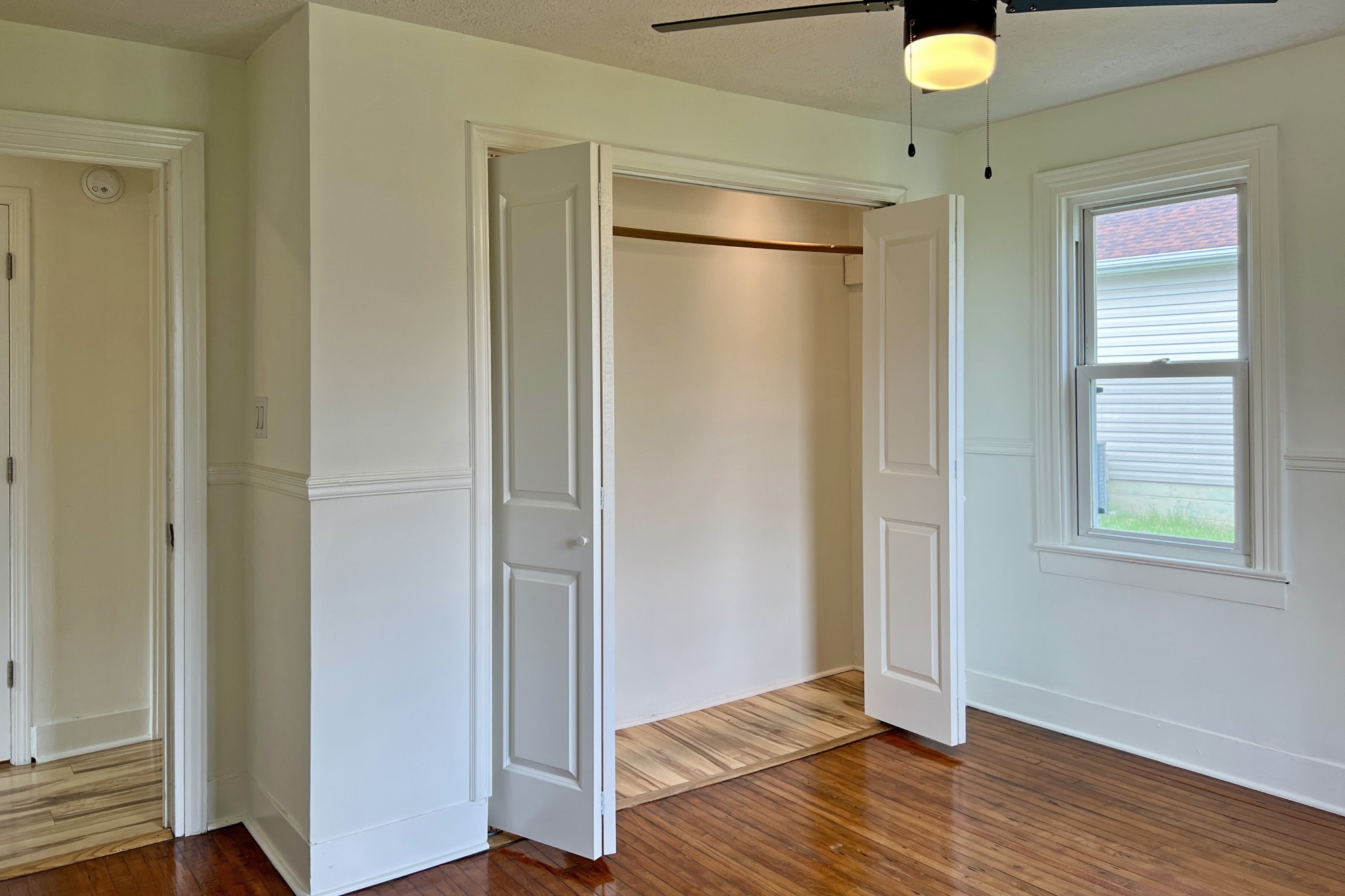 401 North High Street Franklin, KY 42134 - Photo 16 of 28 a view of empty room with wooden floor and fan