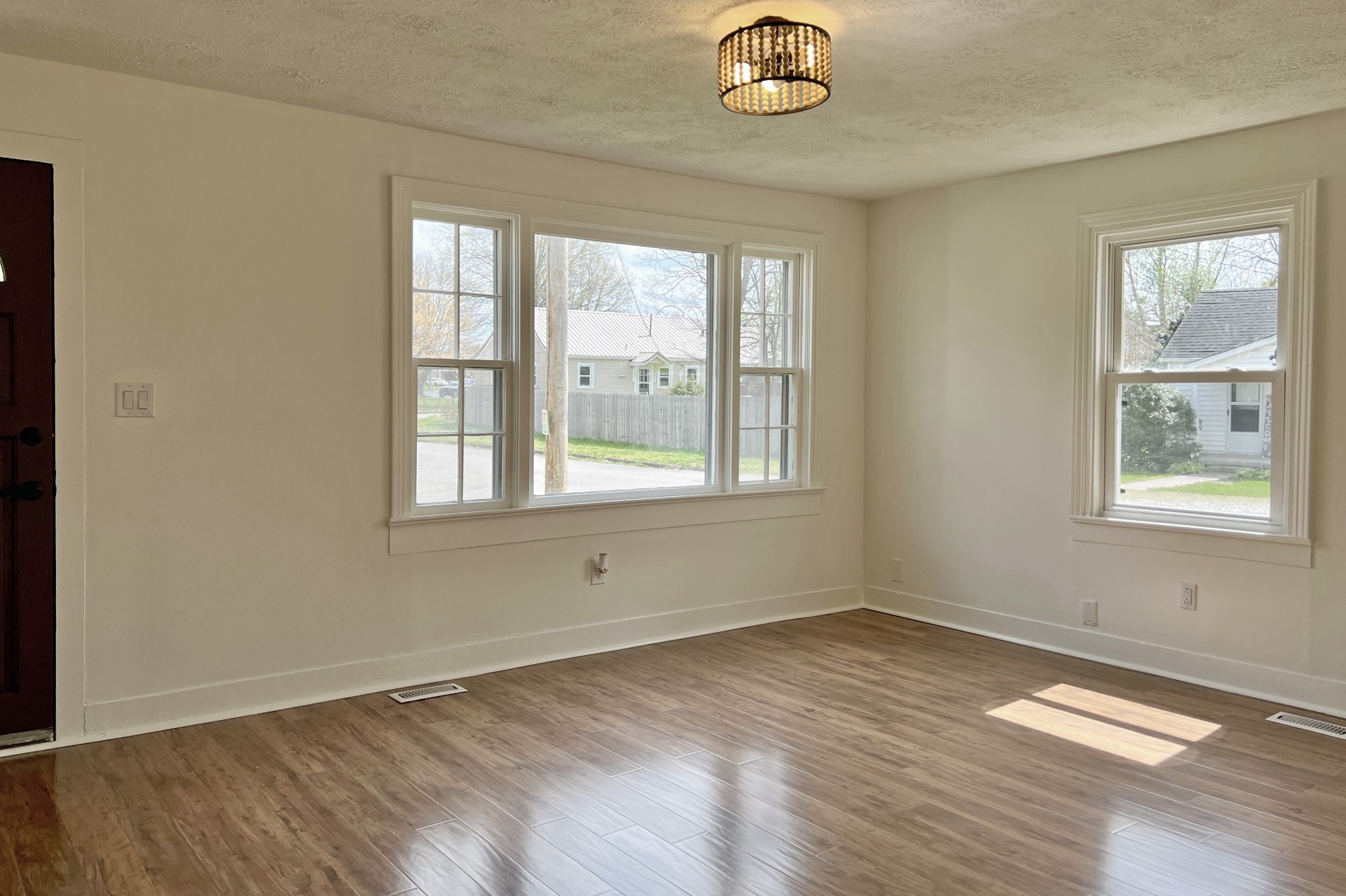 401 North High Street Franklin, KY 42134 - Photo 3 of 28 a view of empty room with wooden floor and fan