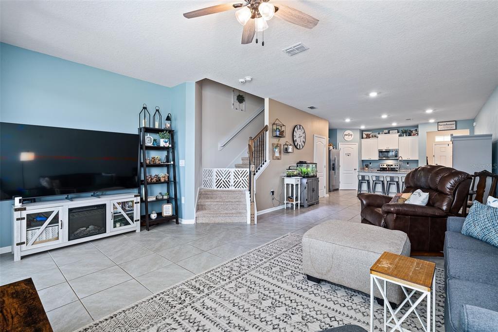 146 Redbud Road Palm Coast, FL 32137 - Photo 27 of 40 a living room with furniture and a flat screen tv