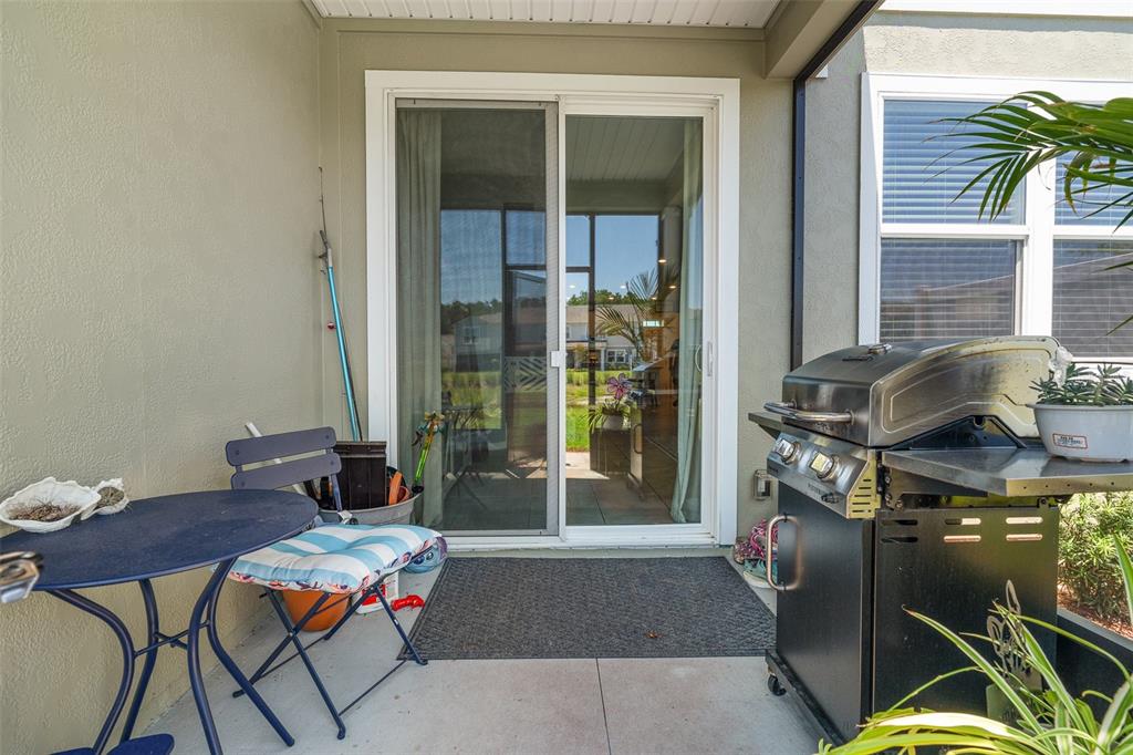 146 Redbud Road Palm Coast, FL 32137 - Photo 28 of 40 a living room with furniture and a window