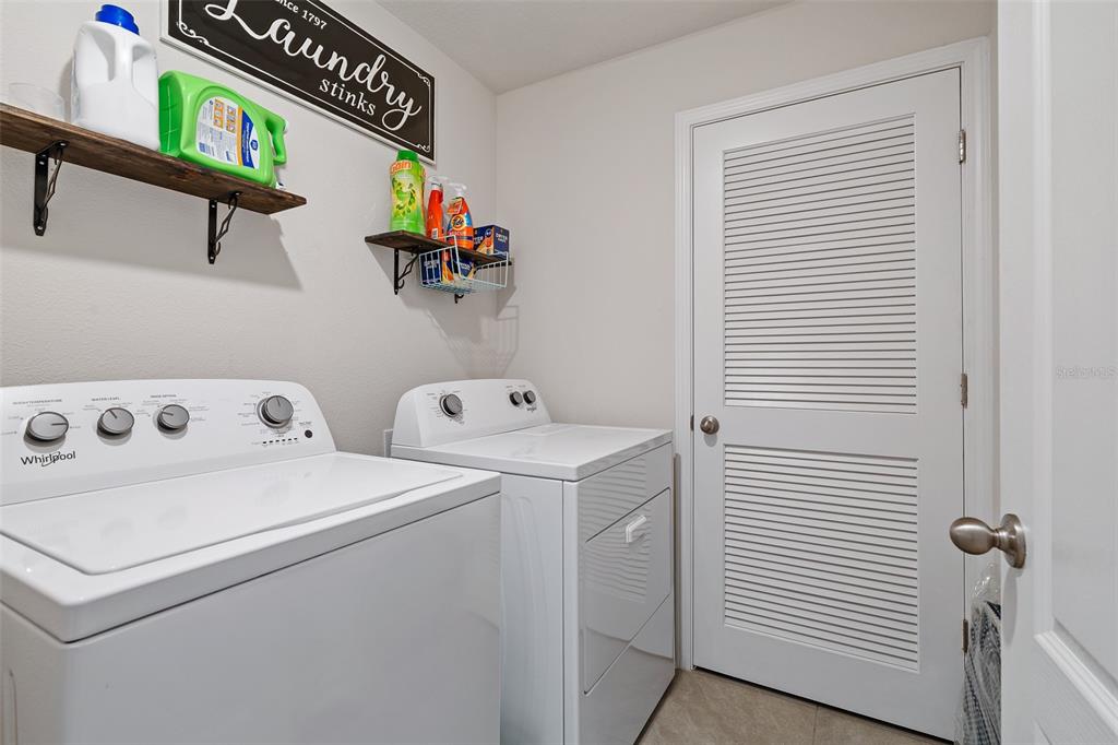 146 Redbud Road Palm Coast, FL 32137 - Photo 30 of 40 a utility room with dryer and washer