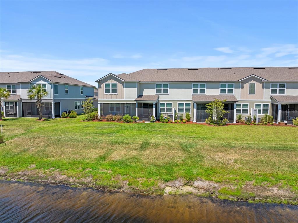 146 Redbud Road Palm Coast, FL 32137 - Photo 40 of 40 a front view of building with yard