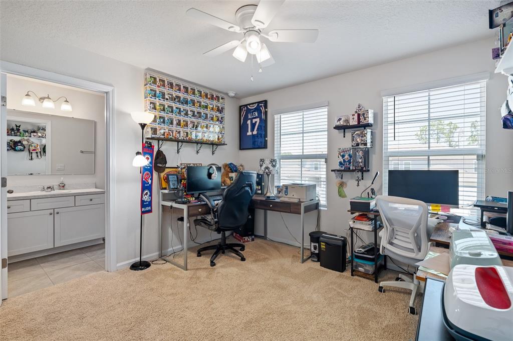 146 Redbud Road Palm Coast, FL 32137 - Photo 9 of 40 a view of a workspace with a window and workspace
