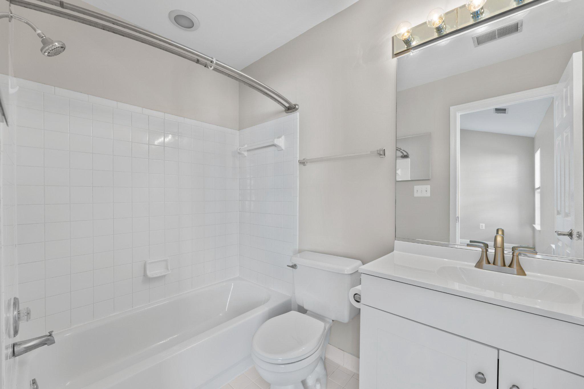 9241 Lorton Valley Road Lorton, VA 22079 - Photo 24 of 45 Master bathroom with sleek design and new vanity.