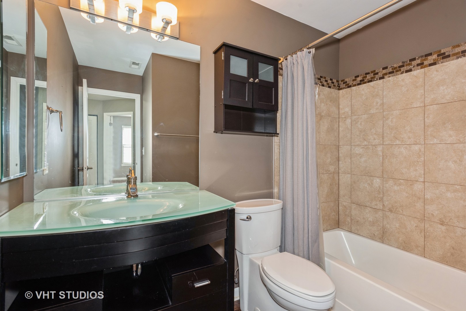 644 Lancaster Circle Elgin, IL 60123 - Photo 13 of 21 a bathroom with a sink a toilet and shower