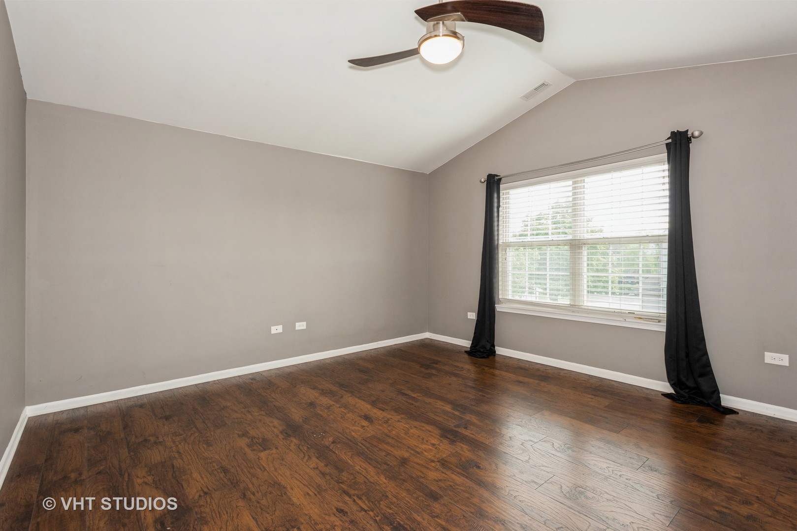 644 Lancaster Circle Elgin, IL 60123 - Photo 15 of 21 an empty room with wooden floor and windows