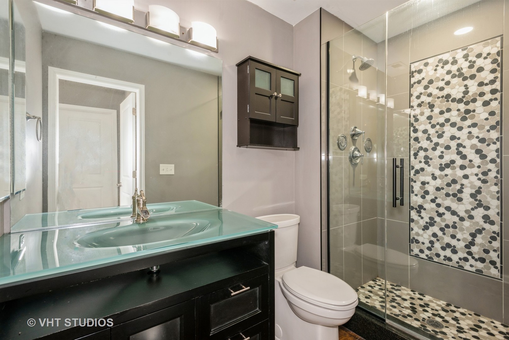 644 Lancaster Circle Elgin, IL 60123 - Photo 16 of 21 a bathroom with a granite countertop sink toilet a mirror a vanity and shower