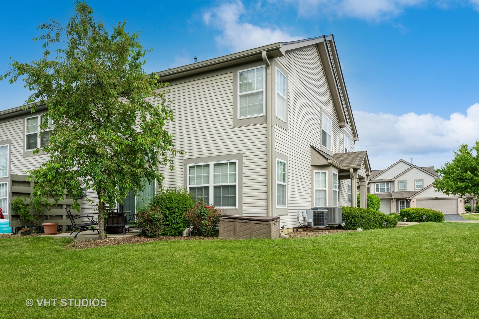 644 Lancaster Circle Elgin, IL 60123 - Photo 18 of 21 a view of a house with a backyard