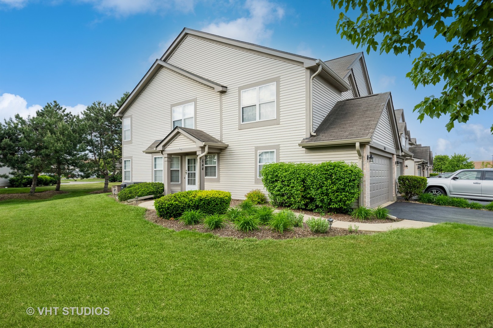 644 Lancaster Circle Elgin, IL 60123 - Photo 3 of 21 a view of a house with a yard and sitting area