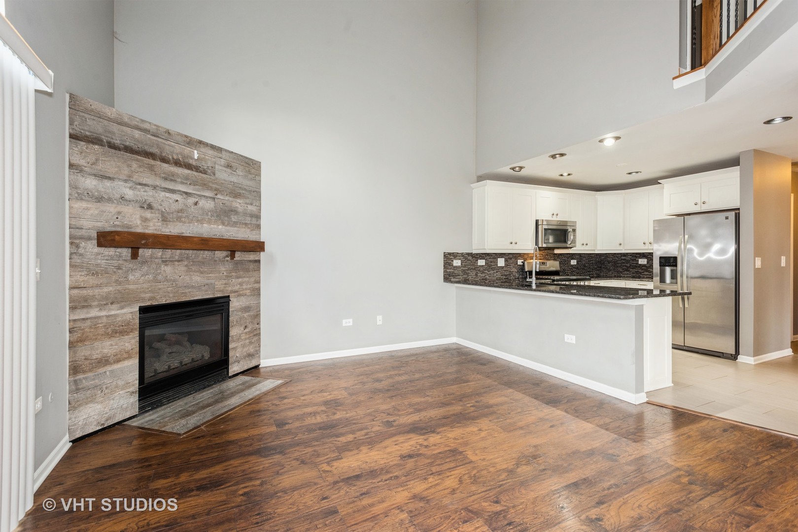 644 Lancaster Circle Elgin, IL 60123 - Photo 6 of 21 a kitchen with stainless steel appliances granite countertop a stove a refrigerator and a sink