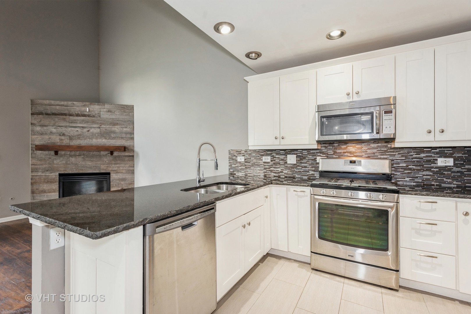 644 Lancaster Circle Elgin, IL 60123 - Photo 8 of 21 a kitchen with granite countertop a stove sink and cabinets