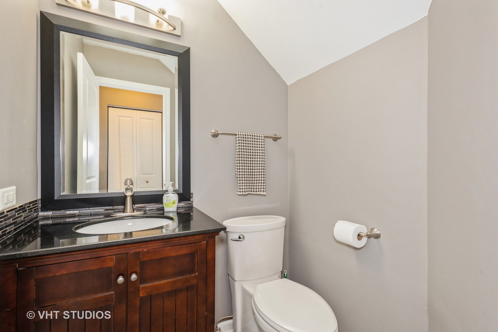 644 Lancaster Circle Elgin, IL 60123 - Photo 9 of 21 a bathroom with a granite countertop sink toilet and mirror