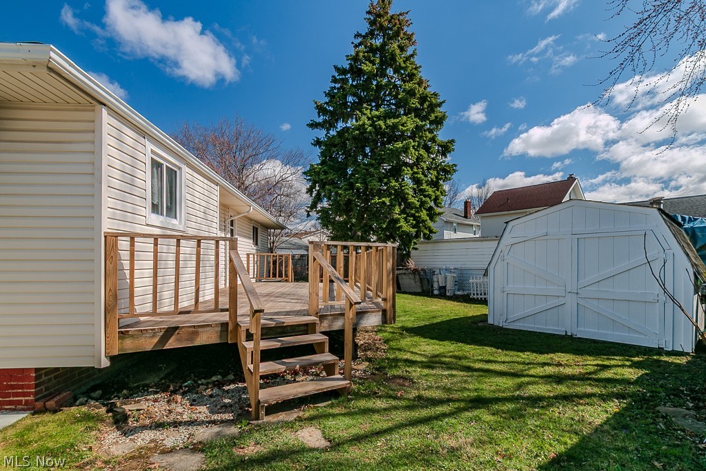 30224 Regent Road Wickliffe, OH 44092 - Photo 26 of 27 View of grassy yard with a shed and a wooden deck