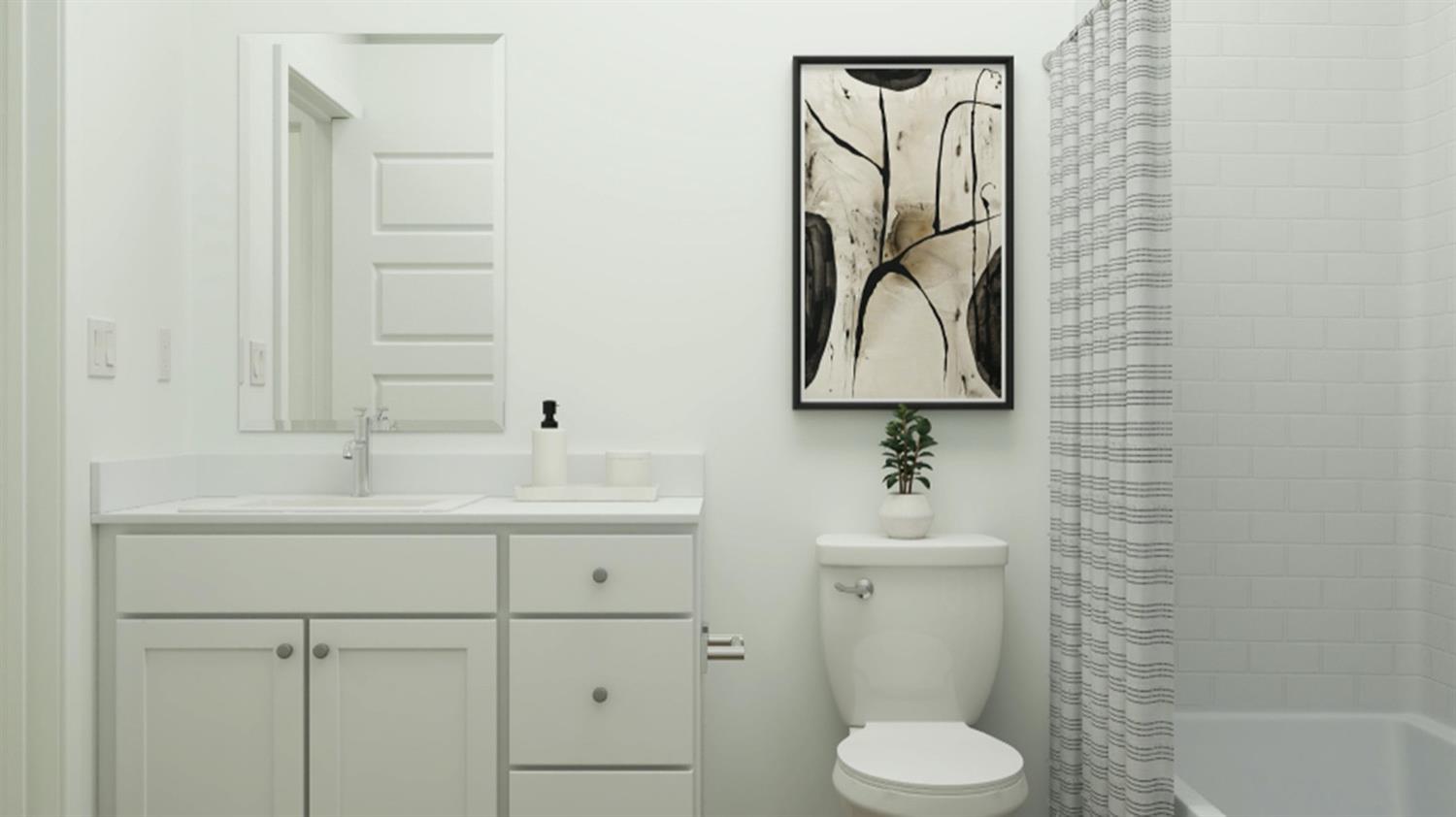 1778 North Aster Lake Road, Unit 60 Hanford, CA 93230 - Photo 7 of 14 a bathroom with a sink toilet and mirror