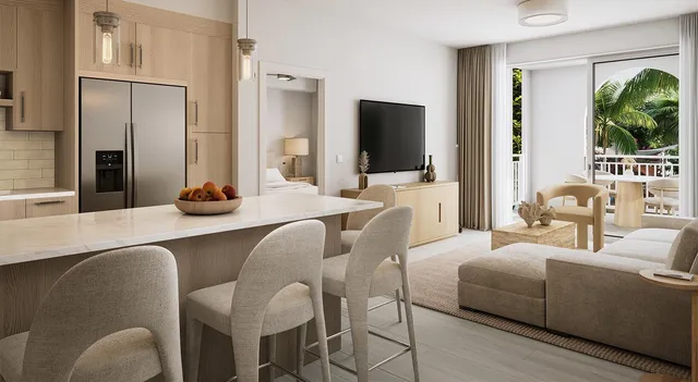 a view of a livingroom with furniture and a flat screen tv