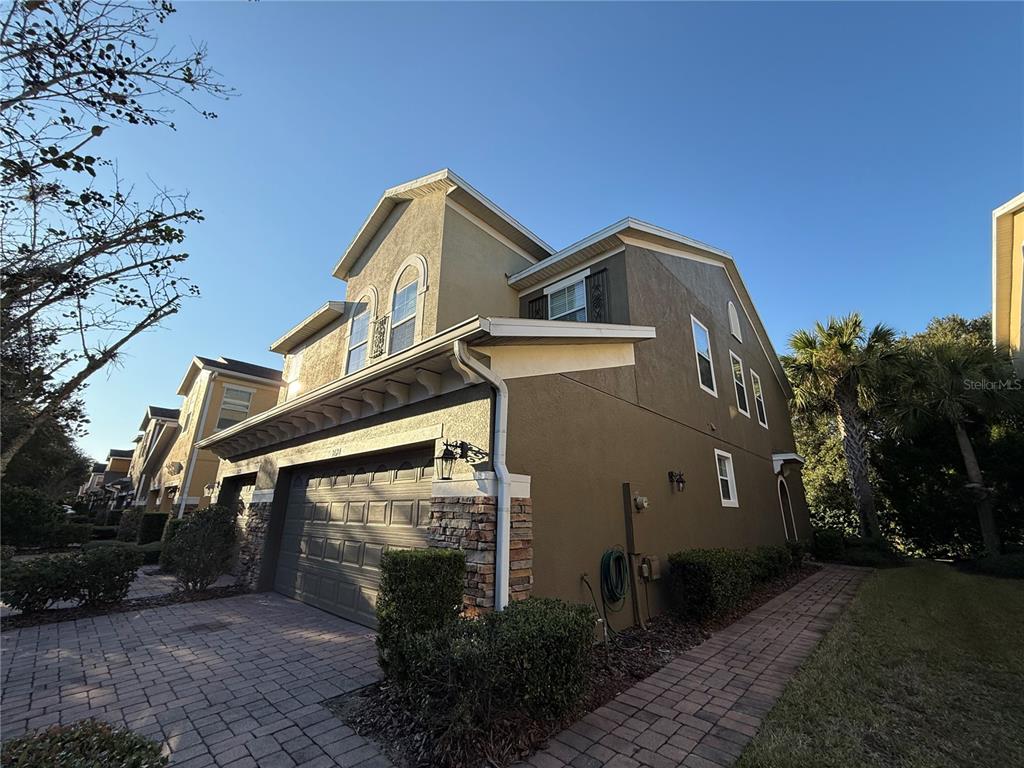 2624 Sweet Magnolia Place Oviedo, FL 32765 - Photo 2 of 25 a front view of a house with a yard