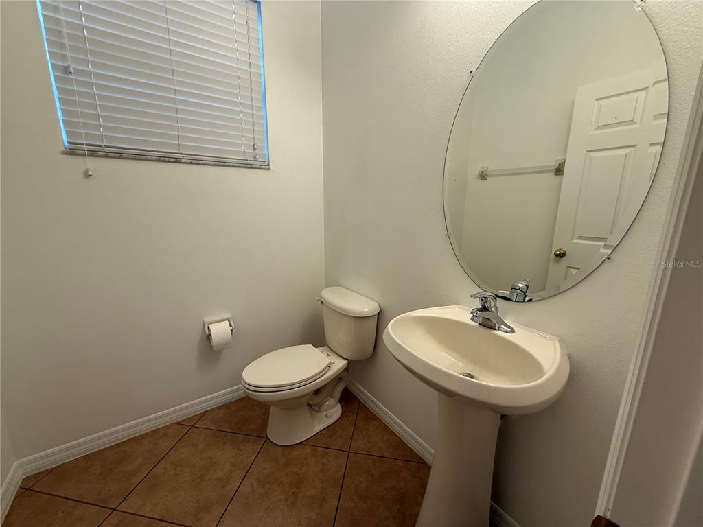 2624 Sweet Magnolia Place Oviedo, FL 32765 - Photo 22 of 25 a bathroom with a sink toilet and a mirror