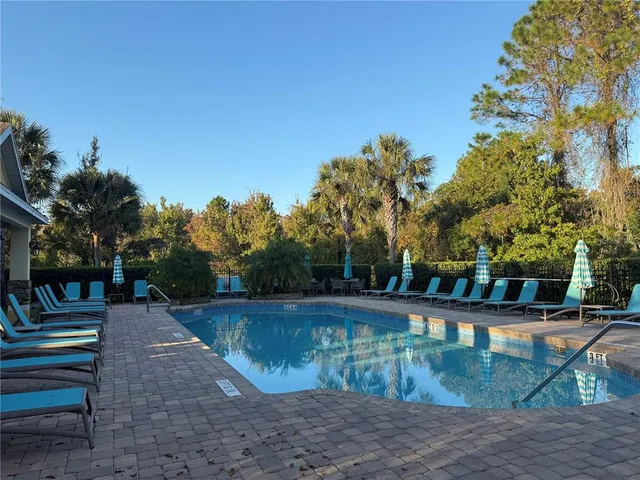 a view of a swimming pool with a patio