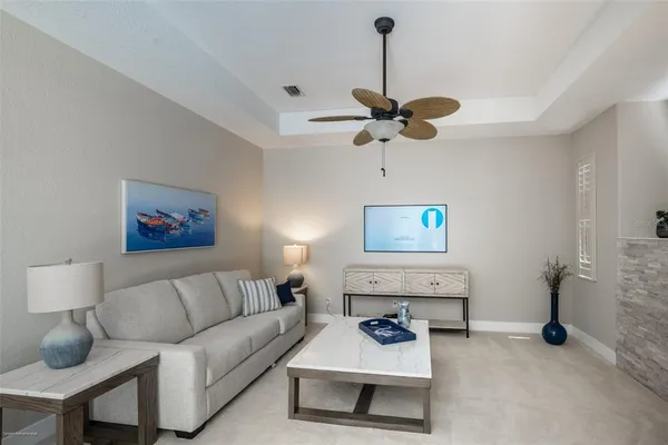 a living room with furniture and a fireplace