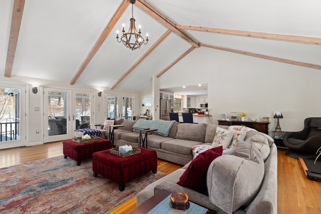 180 Rowley Bridge Road Topsfield, MA 01983 - Photo 11 of 42 a living room with furniture or couch and a chandelier