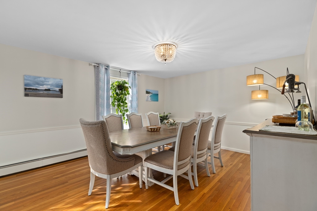 180 Rowley Bridge Road Topsfield, MA 01983 - Photo 14 of 42 a view of a dining room with furniture and a window