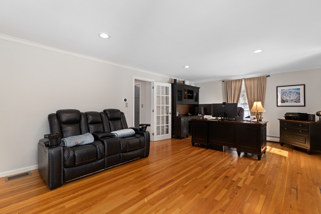 180 Rowley Bridge Road Topsfield, MA 01983 - Photo 18 of 42 a living room with furniture window and wooden floor