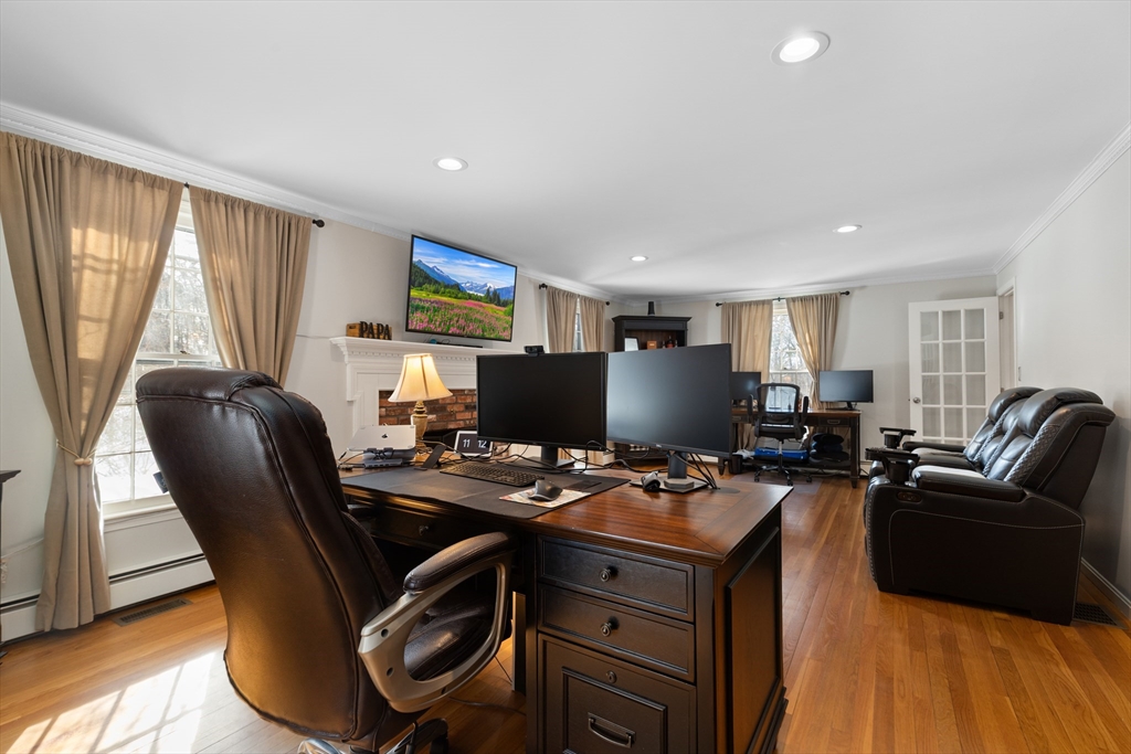 180 Rowley Bridge Road Topsfield, MA 01983 - Photo 19 of 42 a view of a workspace with furniture and a window
