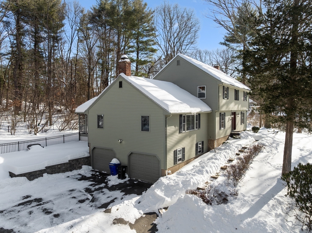 180 Rowley Bridge Road Topsfield, MA 01983 - Photo 2 of 42 a view of a house with a yard covered with snow in the background