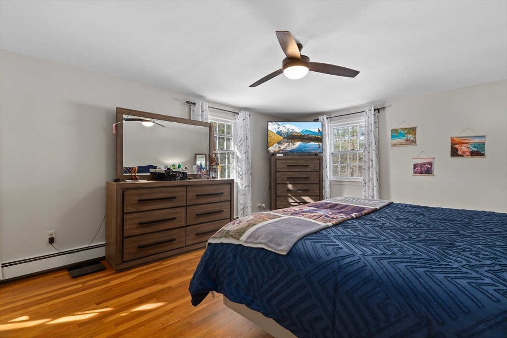 180 Rowley Bridge Road Topsfield, MA 01983 - Photo 30 of 42 a bedroom with a bed and a dresser