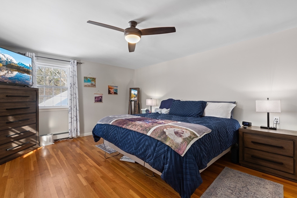 180 Rowley Bridge Road Topsfield, MA 01983 - Photo 31 of 42 a bedroom with a bed and a flat screen tv