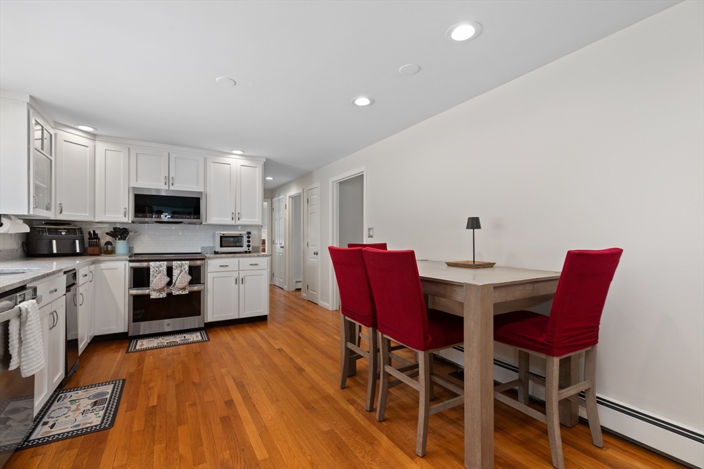 180 Rowley Bridge Road Topsfield, MA 01983 - Photo 9 of 42 a view of a dining room with furniture and wooden floor