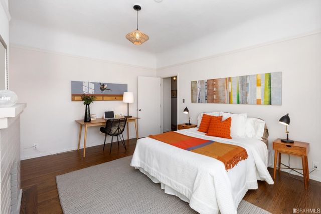 a bedroom with a bed and a table in it