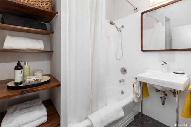 a utility room with a sink dryer and washer