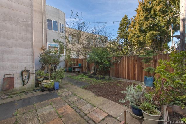 a view of a pathway with a backyard