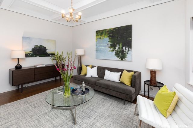 a living room with furniture and a lamp