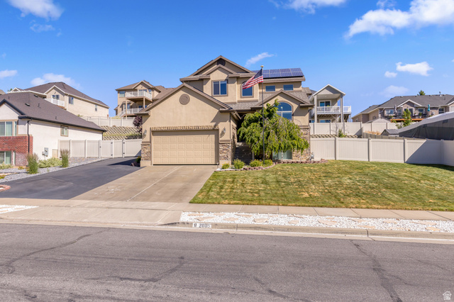 2005 Redtail Way Layton, UT 84040 - Photo 2 of 37 Stucco and stone facade residence featuring an attached two-car garage and solar panels