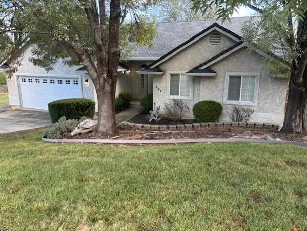 a front view of a house with fire pit